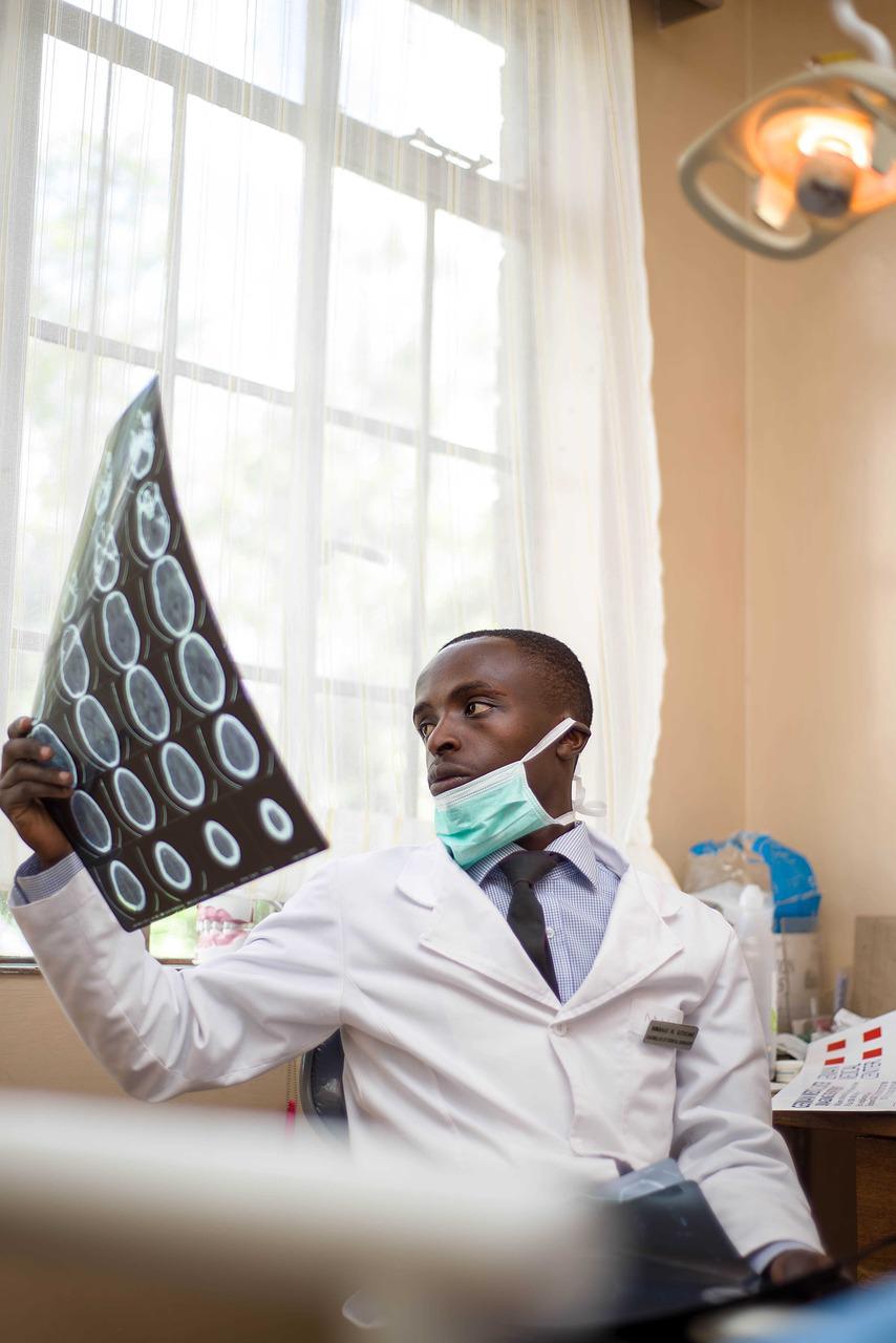 The image of a young dentist at work.